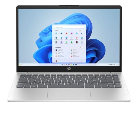 Pc portable hp 15 argenté ouvert sur une table de bureau moderne.