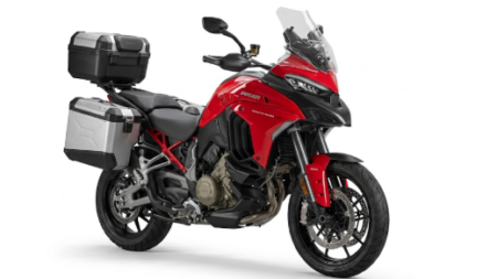Ducati Multistrada V4 S 2026 rouge stationnée sur route avec design sportif et équipements premium.